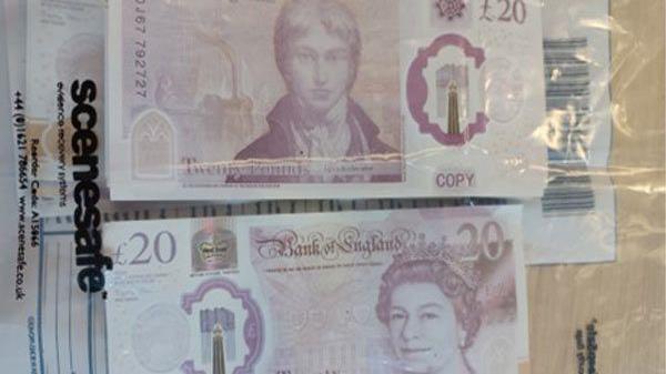 Counterfeit pound notes inside a plastic bag