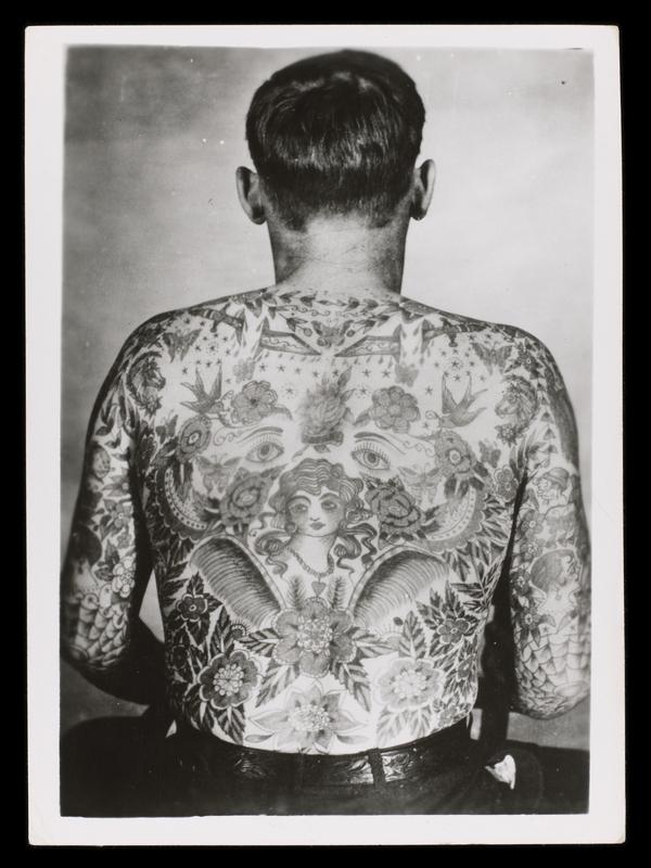 One of Jessie's tattoos on a man's back