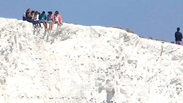 People on cliff edge