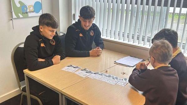 Hull City apprentices Stan Ashbee and Joe Batty with Eastfield Primary School pupils