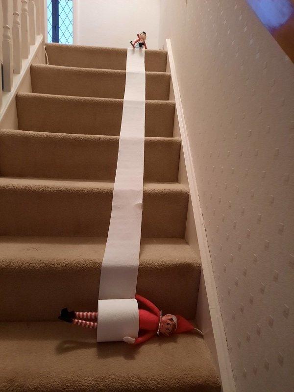 elves on stairs with loo roll