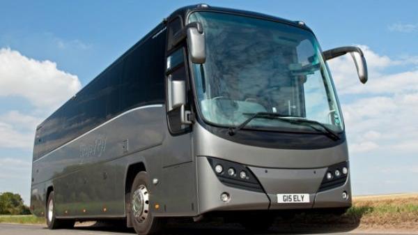 A grey Greys of Ely coach