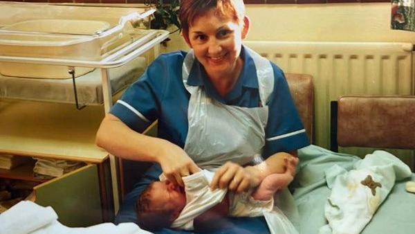 Sharon Cooling holding Katie Wintle after delivering her