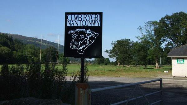 A sign shows the words Nant Conwy RFC and the image of a bull