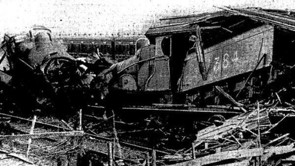 A black and white photo showing the wrecked trains sat head-on