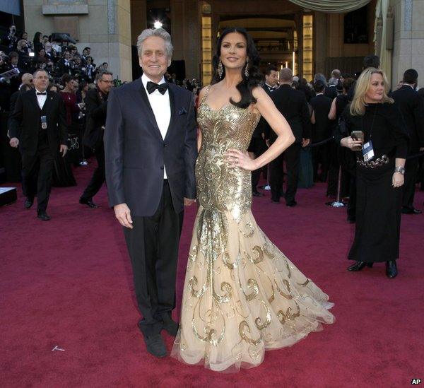 Michael Douglas, left, and Catherine Zeta Jones arrive at the Oscars at the Dolby Theatre, in Los Angeles.