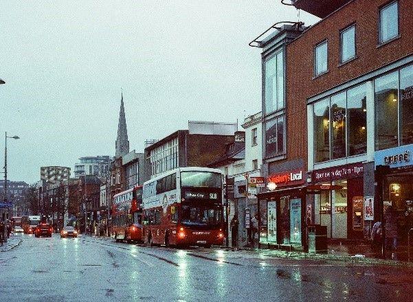 Ealing Broadway traffic scene on wet day with Superloop bus