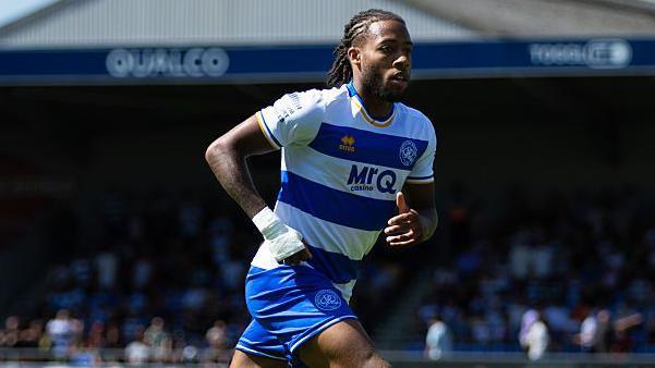 Rumarn Burrell in action for QPR against AFC Wimbledon