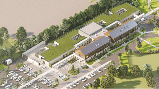 A computer generated image showing an aerial shot of plans for the new Lisnaskea Health Centre. It shows a car park to the left of a large brown and white building. It is also surrounded by forestry.