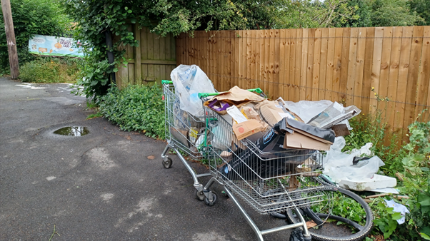 Two abandoned shopping trolleys filled with items at Washington