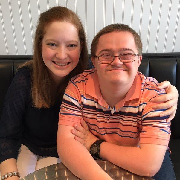 Picture of teenager Lillie and her friend Trevor who has down's syndrome.