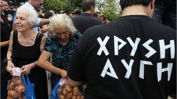 Elderly women receive potatoes from Golden Dawn, 1 Aug 12