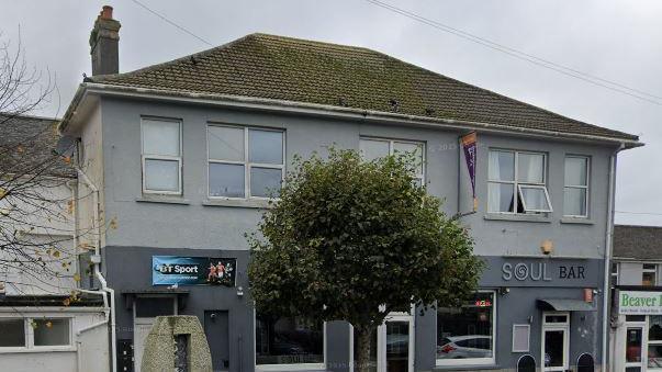 Google Street View image of Soul Bar in Camborne. The building is two shades of grey and has a tree outside the front door.