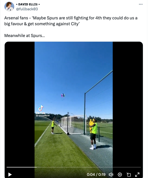 Footballers fly kites on training ground.