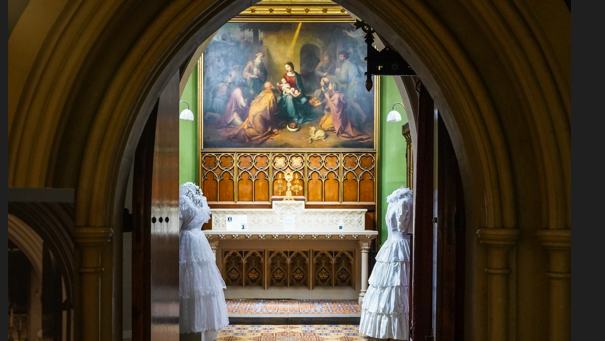 Two dresses at the entrance to the chapel