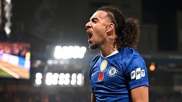 Malo Gusto celebrates scoring for Chelsea