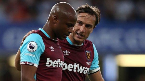 Andre Ayew (left)