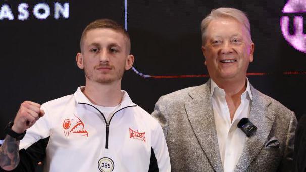 Ryan Garner and Frank Warren pose for a photo