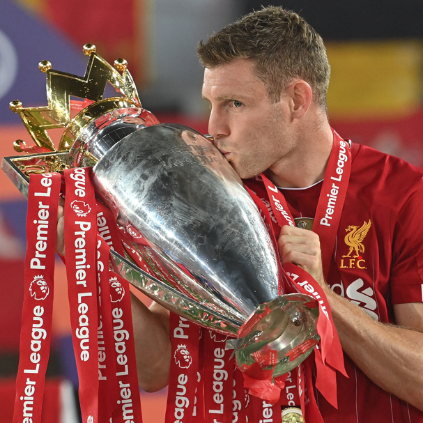 Liverpool's James Milner kisses the Premier League trophy in 2020