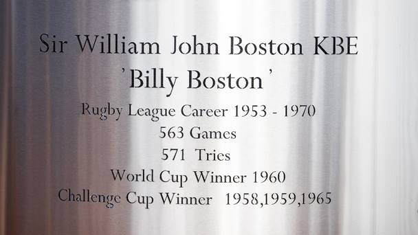A close up image of Sir Billy Boston's name on the statue in its updated form. It reads: Sir William John Boston KBE 'Billy Boston', Rugby League Career 1953 - 1970. 563 Games. 571 Tries. World Cup Winner 1960. Challenge Cup Winner 1958, 1959, 1965.