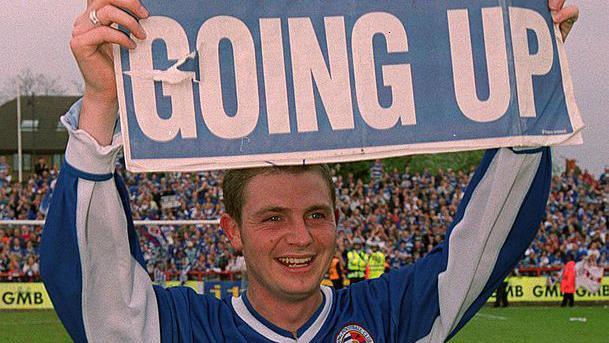 Jamie Cureton celebrates promotion with Reading.