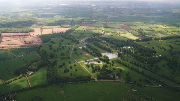 An aerial picture of the Boughton House estate, which consists of vast amounts of fields and trees.