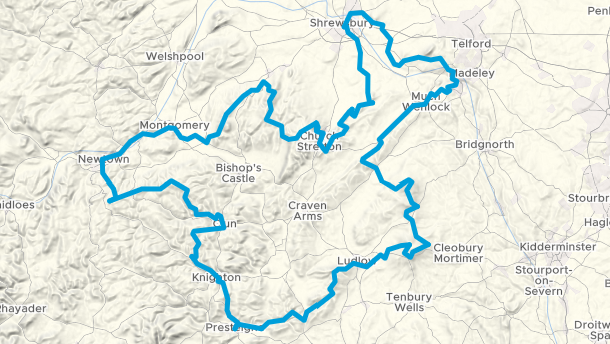 An overhead view of an interactive map, that displays the route of the cycle path. The route is marked out in blue, and runs through Shrewsbury, Much Wenlock, Ludlow, Prestigne, Knighton, Clun, Newtown, Montgomery and Church Stretton, before the loop is completed in Shrewsbury.