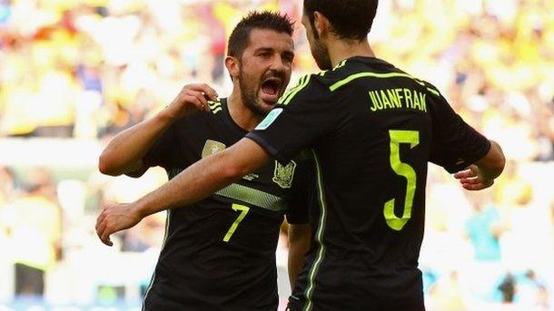 David Villa of Spain (left) celebrates scoring his team's first goal with Juanfran