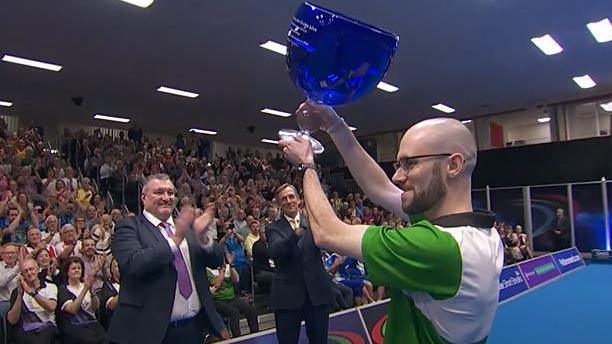 Jason Banks with his singles trophy