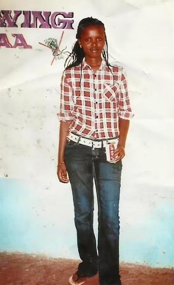 A full-body photo of Agnes Wanjiru wearing jeans and a chequered shirt