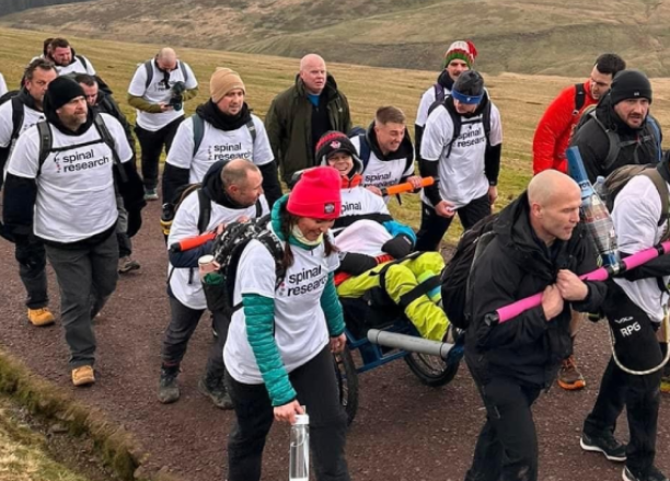 Jon Hobbs being helped up Pen y Fan