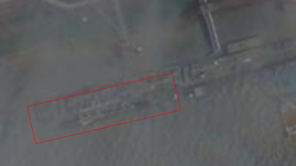 An image from a satellite appears to show a submarine alongside a pier near Wuhan, in China.