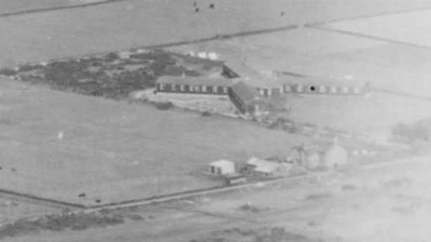 An aerial photo in black and white showing the former military camp from the air in a wartime photo.