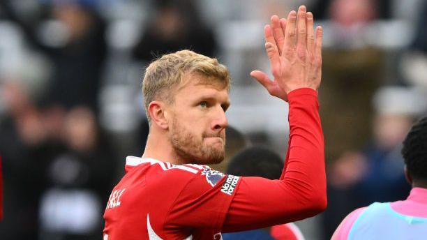 Nottingham Forest defender Joe Worrall applauds the fans