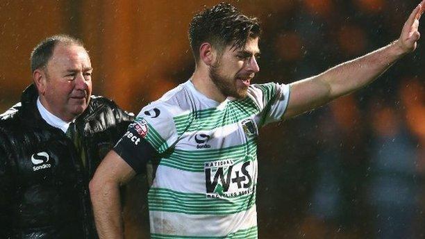 Gary Johnson the manager of Yeovil alongside captain Joseph Edwards