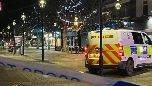 The police crime scene in Goole following the attack with a cordon and police van in the town centre