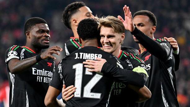 Arsenal captain Martin Odegaard celebrates a goal with Jurrien Timber