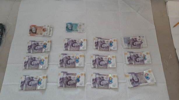 Bundles of cash recovered from the property 