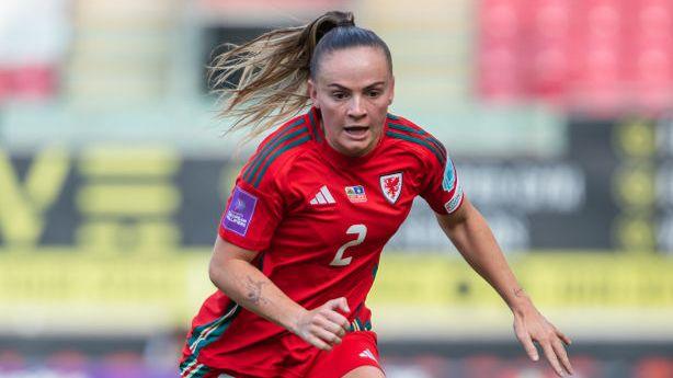 Defender Lily Woodham in action for Wales