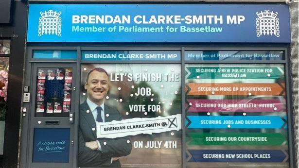 Ex-MP Brendan Clarke-Smith still has his office displaying his title as MP, with the portcullis logo of the House of Commons and recent posters attacking the Labour government's winter fuel allowance cuts in the window.