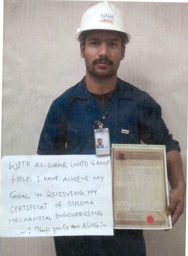 This migrant worker's sign thanks the company for helping him receive a mechanical engineering qualification.