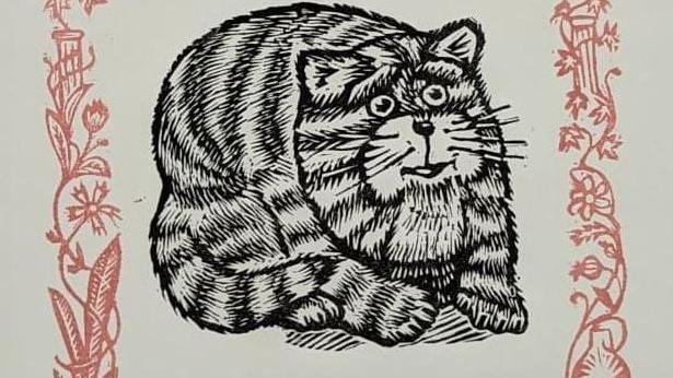 A black and white close up linocut image of a smiling Bagpuss