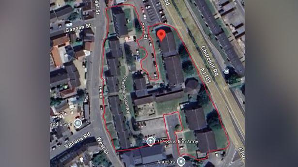 An aerial street view of part of a town. Some roads are marked in red signifying a closure order is in place