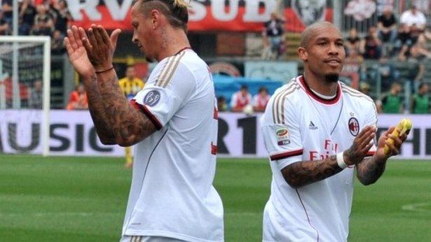 AC Milan players Philippe Mexes and Nigel De Jong after bananas had been thrown at them by Atalanta fans in a Serie A match