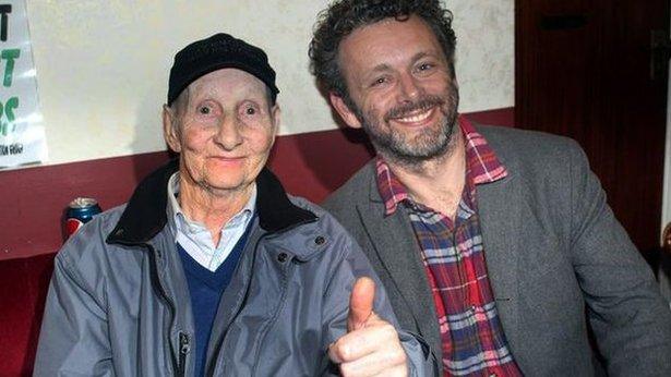 Michael Sheen and Dave Green together during shooting of a documentary