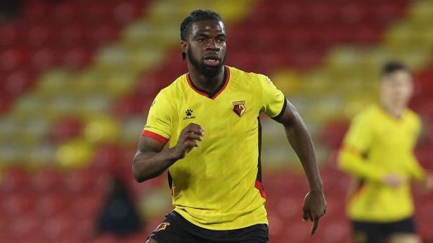 Tobi Adeyemo running on the pitch during a match for Watford under-21s in 2023