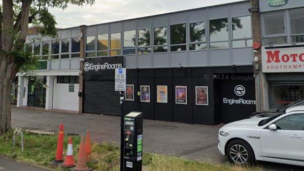 A Google Street View of the outside of a nightclub based on a business estate. Its black frontage is shuttered and closed.