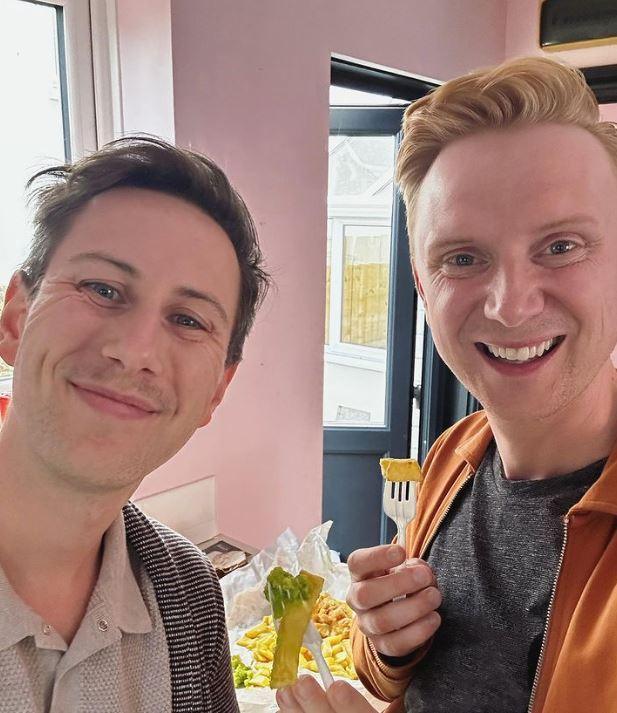 Owain and Aaron eating a bag of chips