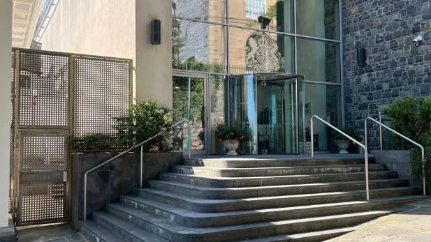 The entrance to the court showing concrete steps and a glass entrance