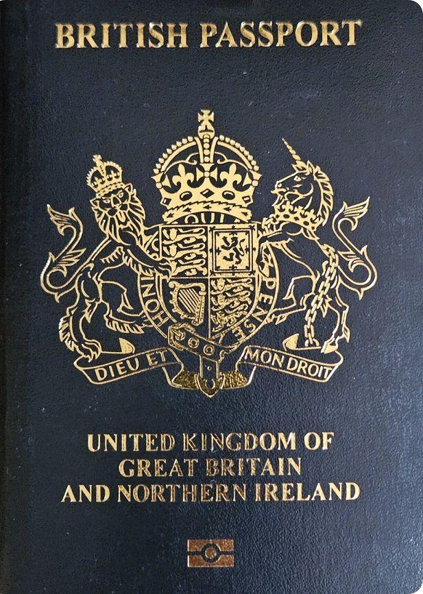 A close-up shot of the updated passport, which is dark blue with the coat of arms in gold.